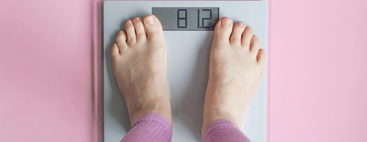 Woman watching her weight . Weight loss. Healthy weight.